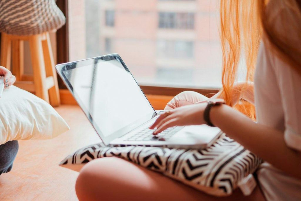 free ai tools for moms - woman working on laptop at home